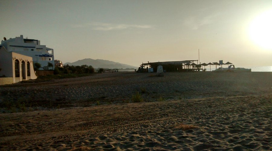 Vera Playa beach at dawn with Cota Zero Pirate Bar in distance