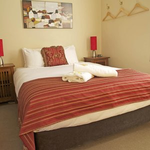 Queen bed with hanging space