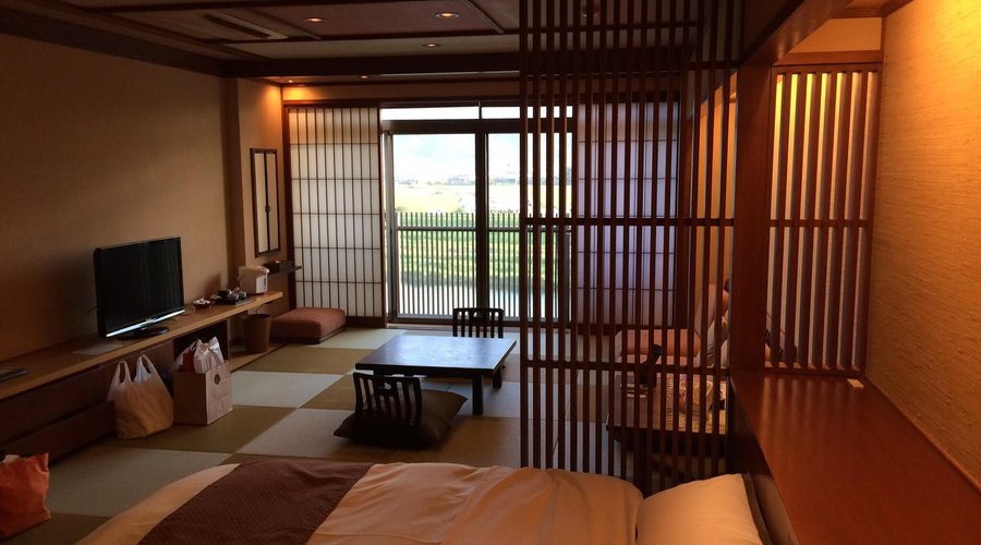Bedroom with small balcony overlooking river