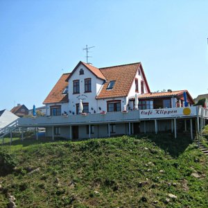 View of the hotel and cafe deck from the seaside