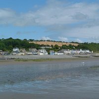 A view across the beach to the village of Amroth