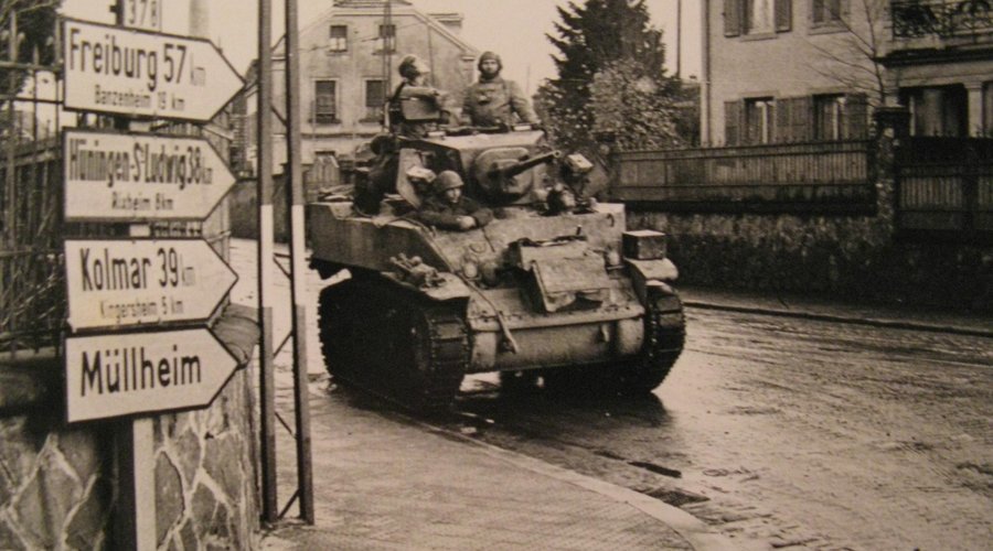 Display photo: note the German spelling on the signposts (The Germans did this all across France