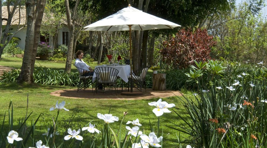 Enjoy alfresco dining in our lush gardens -  upon request