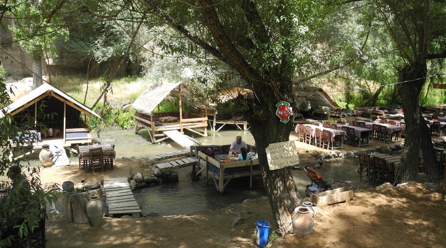 Tables for larger groups and gazebos on the river for smaller groups.
