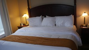 Lunenburg Arms Hotel in Lunenburg, image may contain: Bed, Furniture, Cushion, Lamp