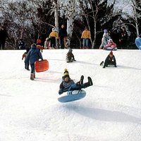 There is a large sledding hill with a tow line.