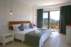 Arnna Hotel in Kas, image may contain: Bed, Furniture, Chair, Bedroom