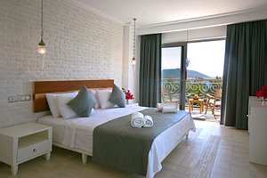 Arnna Hotel in Kas, image may contain: Bed, Furniture, Chair, Bedroom