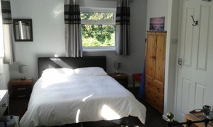 The Sportsmans Valley Hotel in Menheniot, image may contain: Lamp, Furniture, Dorm Room, Bed