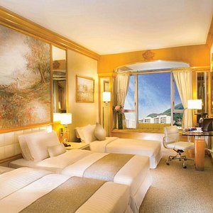 Regal Hongkong Hotel in Hong Kong, image may contain: Home Decor, Chair, Furniture, Bedroom