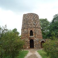 The circular holes at the upper tier were where head was hanged for display.