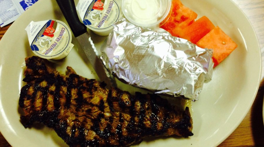 New York Strip, baked potato and watermelon squares to cleanse the palate.
