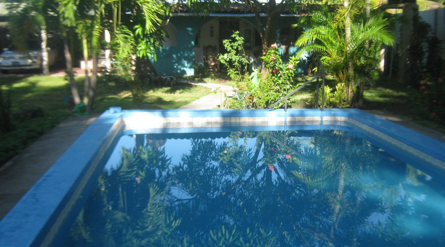 Pool with the ranch house in background