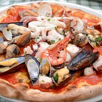 Pizza con frutti di mare Пицца с морепродуктами