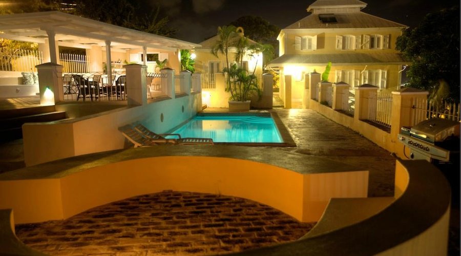 Pool, dining area in the evening