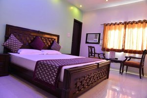 Hotel Amax Inn in New Delhi, image may contain: Resort, Hotel, Bed, Chair