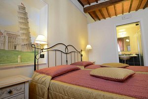 Hotel Di Stefano in Pisa, image may contain: Bed, Furniture, Hotel, Bedroom