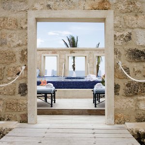 The Crane Resort in Barbados, image may contain: Hot Tub, Tub, Hotel, Building