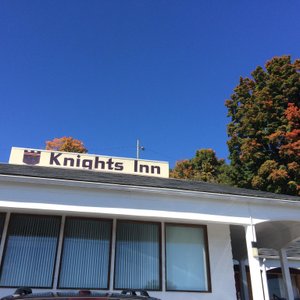Up-close view of main building with autumn colors in background