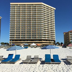view of Seawinds from beach (401 is first balocny above parking garage  on far right