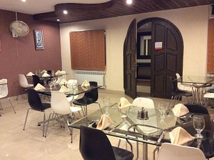 Prestige Hotel And Resort in Islamabad, image may contain: Dining Room, Dining Table, Table, Restaurant