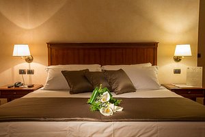 Romantic Hotel Furno in San Francesco al Campo, image may contain: Cushion, Home Decor, Lamp, Table Lamp