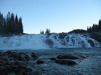 Laksforsen cascade in Grane municipality in Nordland Province in Norway  running over some 17 meter high cascades over a rocky stretch Stock Photo -  Alamy