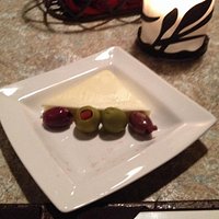 Butter and olives served with fresh bread