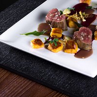 Crispy veal tenderloin, beetroot cream, roasted garlic and pumpkin gnocchi
