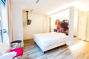 Qbic Hotel Amsterdam WTC in Amsterdam, image may contain: Furniture, Bedroom, Indoors, Interior Design
