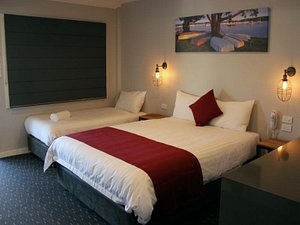 Merewether Motel in Newcastle, image may contain: Bed, Furniture, Lamp, Home Decor