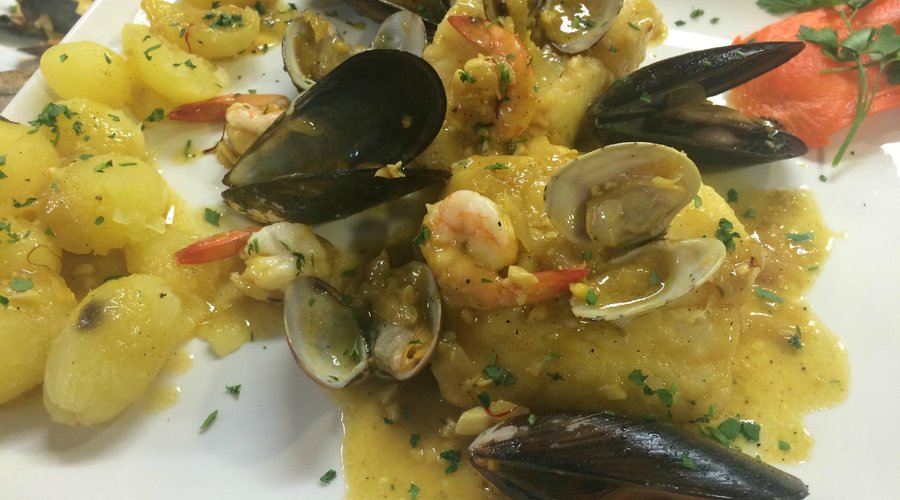 Baccala In salsa di zafferano con frutti di mare