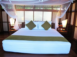 Jicaro Island Lodge Granada in Isletas de Granada, image may contain: Furniture, Bed, Bedroom, Indoors