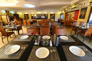 Motel Highway in Chennai (Madras), image may contain: Restaurant, Dining Room, Dining Table, Cafeteria