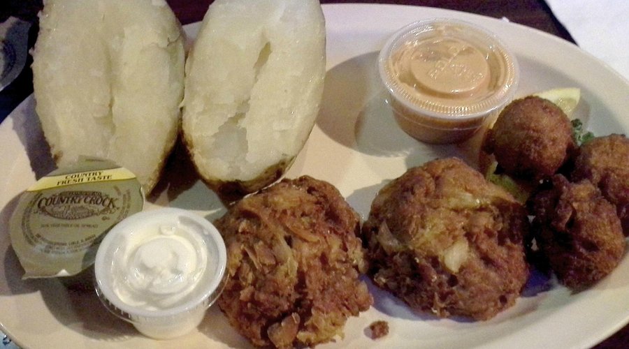 Crab cake dinner with baked potato