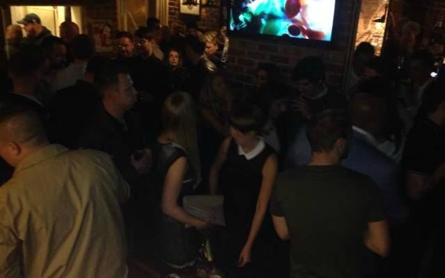 Pub front on a Saturday evening around 12