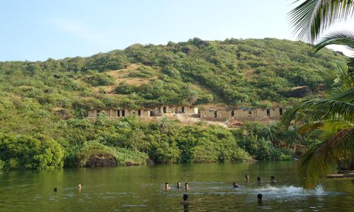 People taking bath at the lake.
