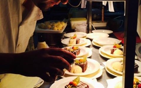 Chef preparing his signature chocolate brownies