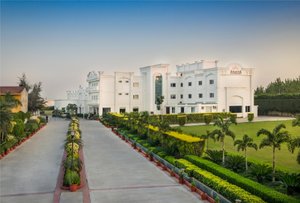 Hotel Ananya Regency in Kashipur, image may contain: Resort, Hotel, Hedge, Grass