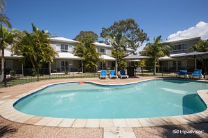 NRMA Treasure Island Holiday Resort in Biggera Waters, image may contain: Hotel, Resort, Villa, Pool