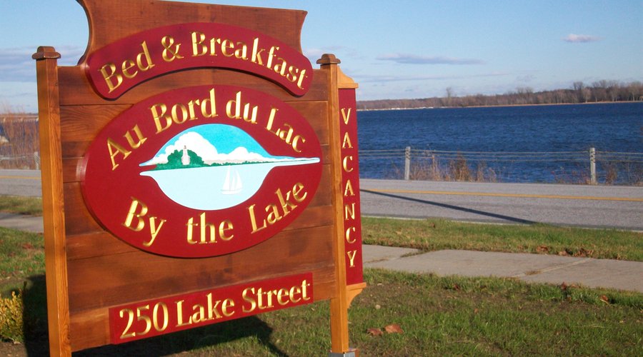 Our sign with the view of the lake in the background