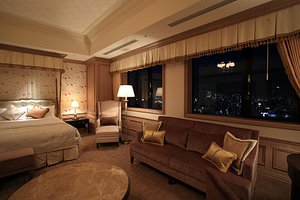 Hotel Monterey Grasmere Osaka in Osaka, image may contain: Couch, Living Room, Home Decor, Bed