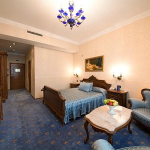 Grand Hotel London in Varna, image may contain: Furniture, Bed, Painting, Bedroom