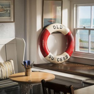 The Old Success Inn in Sennen Cove, image may contain: Bed, Furniture, Monitor, Painting