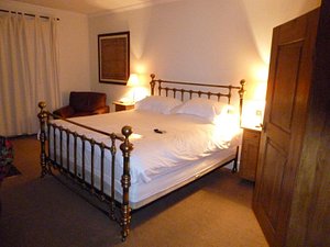 Sedlescombe Golf Hotel in Sedlescombe, image may contain: Bed, Furniture, Bedroom, Indoors