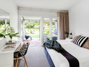 Pinetrees Lodge in Lord Howe Island, image may contain: Door, Chair, Bed, Housing