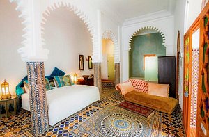 Blanco Riad Hotel & Restaurant in Tetouan, image may contain: Home Decor, Cushion, Couch, Furniture