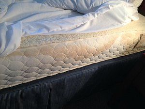 Stain on right side mattress (facing bathroom in room)
