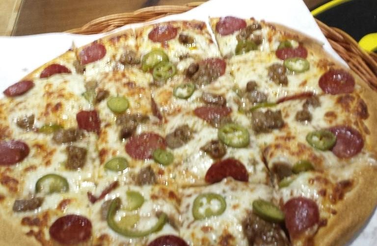 Huge meat pizza with Chili