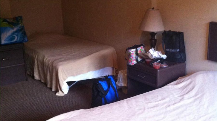 No headboards, no blankets, only dirty sheets/mattress on floor.